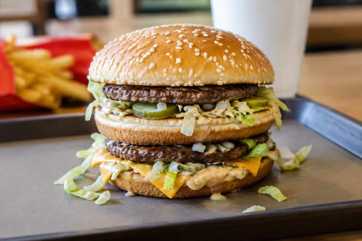 A Big Mac with fries and a drink on a restaurant tray.
